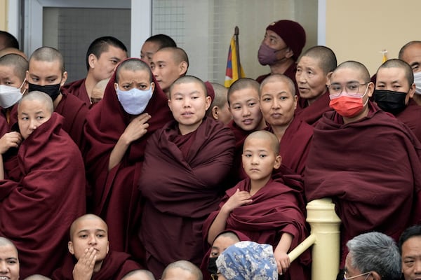 Exiled Tibetan Buddhist nuns participate in an event to mark the 66th anniversary of an uprising in Tibetan capital Lhasa, as they gather at the Tsuglakhang temple in Dharamshala, India, Monday, March 10, 2025. (AP Photo/Ashwini Bhatia)