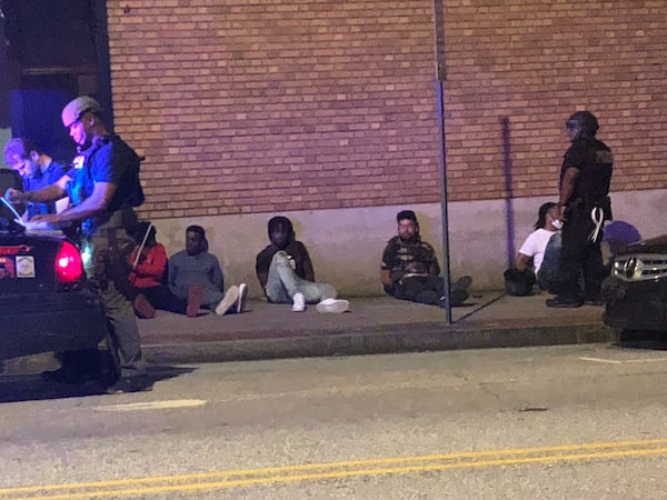 Police were detaining people out in downtown Atlanta after the city's 9 p.m. Saturday, May 30, 2020 curfew. DAVID WICKERT / AJC