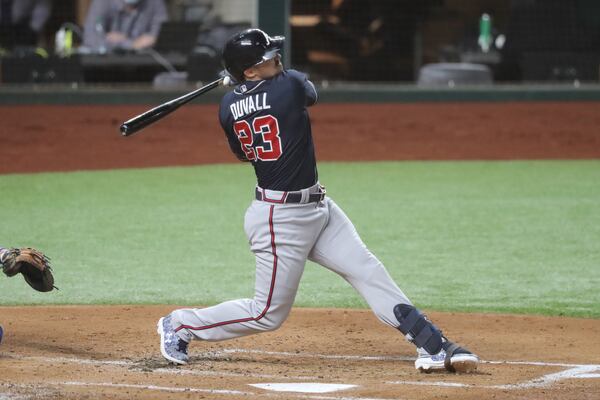 Braves left fielder Adam Duvall gets injured on this swing against the Los Angeles Dodgers during the second inning in Game 1 Monday, Oct. 12, 2020, for the best-of-seven National League Championship Series at Globe Life Field in Arlington, Texas. Duvall had to leave the game. (Curtis Compton / Curtis.Compton@ajc.com)

