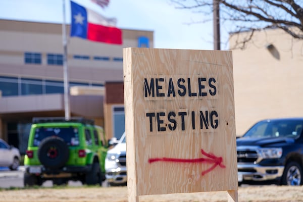 A sign is seen outside of Seminole Hospital District offering measles testing Friday, Feb. 21, 2025, in Seminole, Texas. (AP Photo/Julio Cortez)