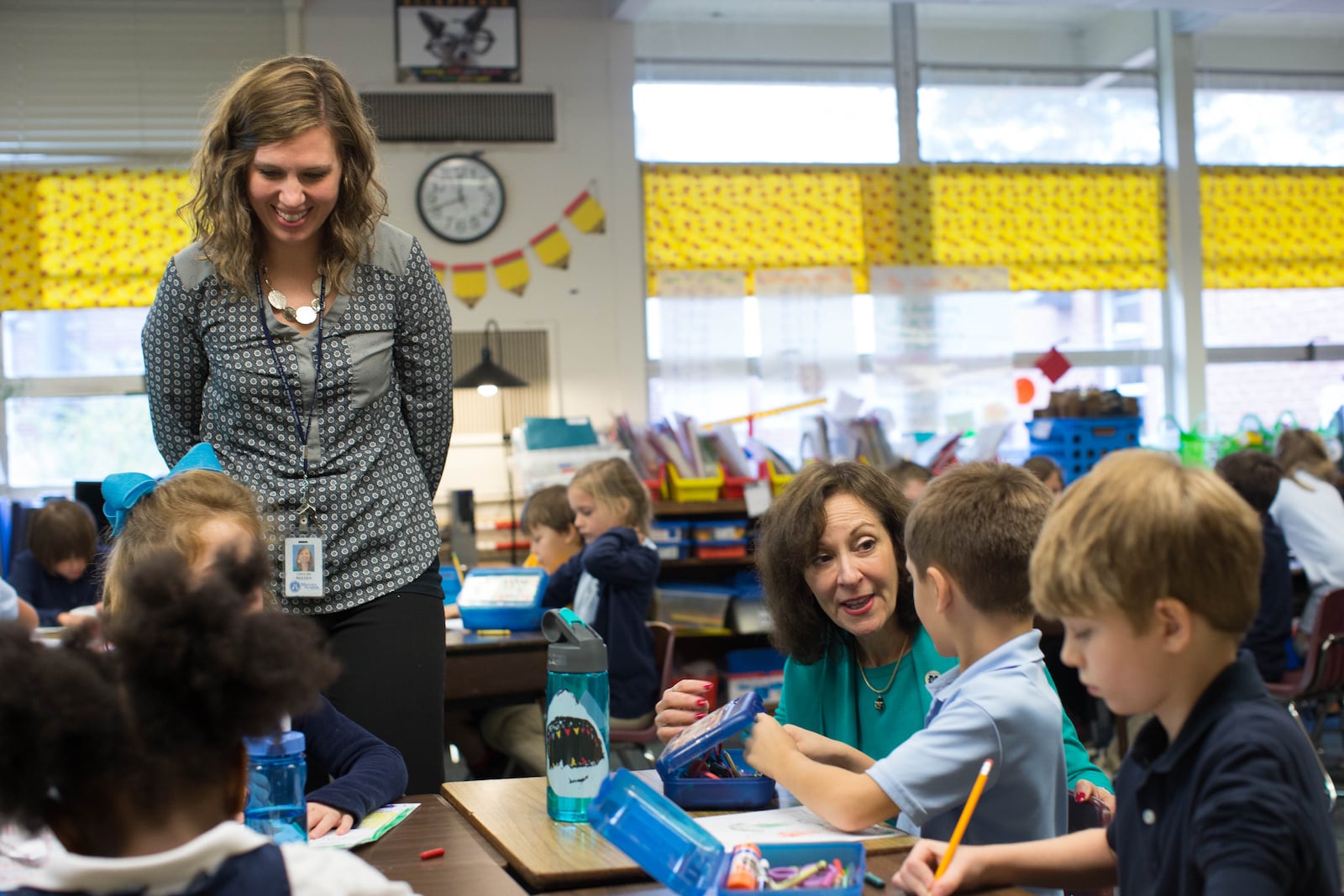 1st grade teacher Carrie Reeser, left, and Marietta City Schools Superintendent Dr. Emily Lembeck, who taught Reeser in 1st grade, talk with students at West Side Elementary, Wed. Nov. 30, 2016, in Marietta, Ga.  BRANDEN CAMP/SPECIAL