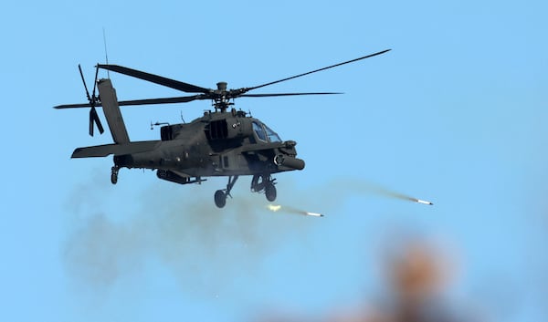 A South Korea army's Apache Guardian helicopter fires rockets during the joint military drill between South Korea and the United States at Seungjin Fire Training Field in Pocheon, South Korea, Thursday, March 6, 2025. (Yonhap via AP)