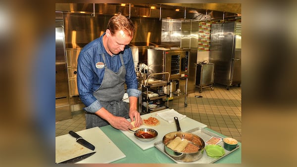 Chick-fil-A chef Stuart Tracy shows some artful food prep prior to serving his Chicken Enchiladas from Scratch Mealtime Kit from Chick-Fil-A. Chick-fil-A meal kits will be available in Atlanta-area restaurants starting Aug. 27.