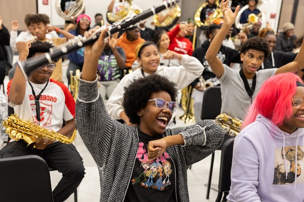 The Jonesboro High School marching band rehearses at the high school in Jonesboro on Wednesday, November 20, 2024. The band will play in the Macy's Thanksgiving Day Parade in New York and New Year's Day Parade in London. (Arvin Temkar / AJC)