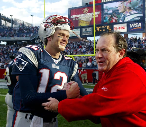 New England Patriots head coach Bill Belichick congratulates quarterback Tom Brady after the Patriots won their 19th game in a row, a 24-10 win over the Miami Dolphins at Gillette Stadium in Foxboro, Mass. Sunday, Oct. 10, 2004. (AP Photo/Winslow Townson)