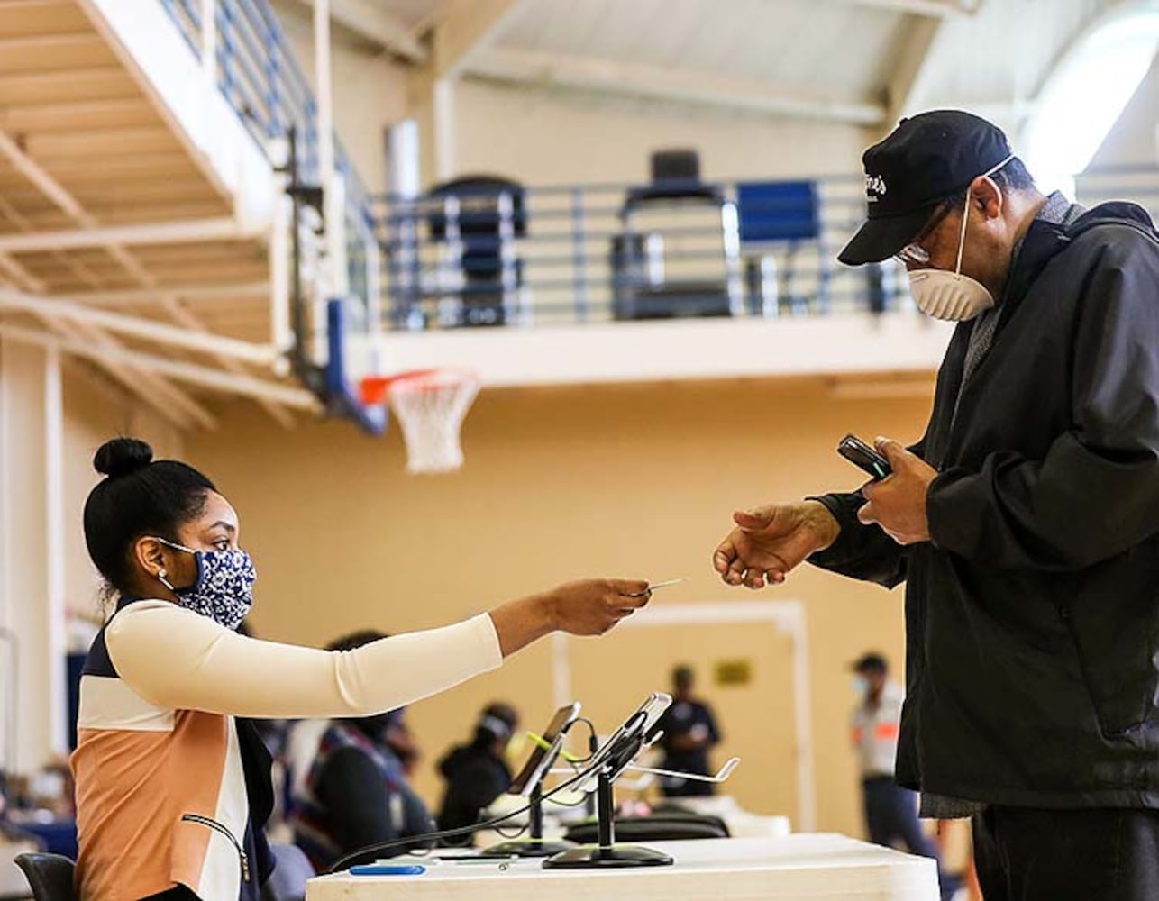 PHOTOS: Georgia voters struggle with long lines, new equipment, social distancing