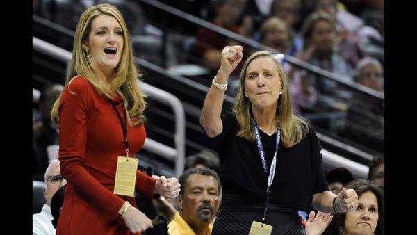 Kelly Loeffler, left, and Mary Brock have co-owned Atlanta's WNBA franchise, the Dream, since 2011. She recently attacked the league's decision to support and honor Black Lives Matter initiatives. That led to a coordinated backlash Tuesday from WNBA players, including members of the Dream, who wore shirts urging voters to support the Rev. Raphael Warnock, who is running against Loeffler's in November's special election. (AP Photo/J. Scott Applewhite) </p>