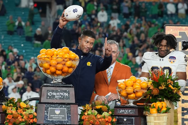 Notre Dame head coach Marcus Freeman gestures to the team after winning the Orange Bowl College Football Playoff semifinal game against Penn State on Thursday, Jan. 9, 2025, in Miami Gardens, Fla. (Lynne Sladky/AP)