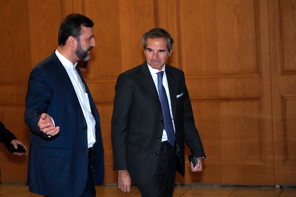 International Atomic Energy Organisation (IAEA) Director General Rafael Mariano Grossi, right, arrives for a meeting with Iranian Foreign Minister Abbas Araghchi as he is accompanied by Deputy Foreign Minister Kazem Gharib Abadi, in Tehran, Iran, Thursday, Nov. 14, 2024. (AP Photo/Vahid Salemi)