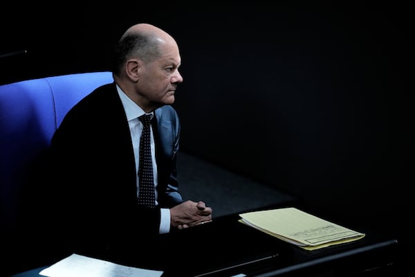 German Chancellor Olaf Scholz attends a debate and voting about loosen the country's debt rules and change constitution in the German Parliament Bundestag in Berlin, Germany, Tuesday, March 18, 2025. (AP Photo/Ebrahim Noroozi)