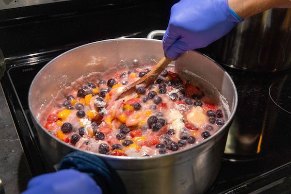 Mike Massey works on making one of his jam recipes in the kitchen of his Decatur home. He gives his homemade jams to the Lawrenceville co-op, a food bank serving Gwinnett & other Counties. PHIL SKINNER FOR THE ATLANTA JOURNAL-CONSTITUTION