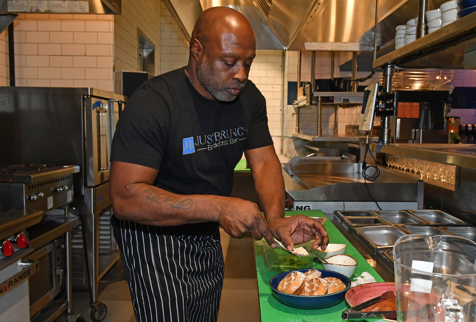 Keith Kash experiments with duck and waffles (not currently on the menu) at Just Brunch. (CHRIS HUNT FOR THE ATLANTA JOURNAL-CONSTITUTION)