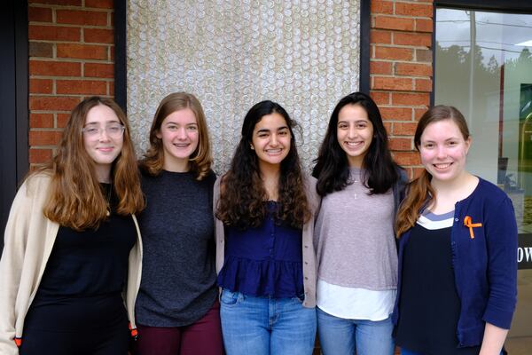 Walton High School walkout organizers include, from left, sophomore Natalie Carlomagno, senior Emma Fletcher, freshman Divya Virmani, junior Anisa Handa, and senior Madeleine Deisen. The students worked weeks in advance of Wednesday's walkout to organize classmates, meet with administrators, and spread their message calling for gun-law reforms. AJC/Vanessa McCray