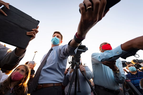 Reporter Greg Bluestein as Democratic candidates for U.S. Senate Jon Ossoff and Raphael Warnock rally with supporters at the Cobb Civic Center on Sunday, Nov.15, 2020, in Marietta, Ga. (JOHN AMIS FOR THE ATLANTA JOURNAL-CONSTITUTION)