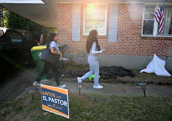 October 19, 2022 Forest Park - Vanessa Jasso (left) and Bryna Jimenez, both with GALEO, canvass for Latino voters in Forest Park on Tuesday, August 19, 2022. GALEO's mission is to increase civic engagement and leadership of the Latino/Hispanic community across Georgia. (Hyosub Shin / Hyosub.Shin@ajc.com)