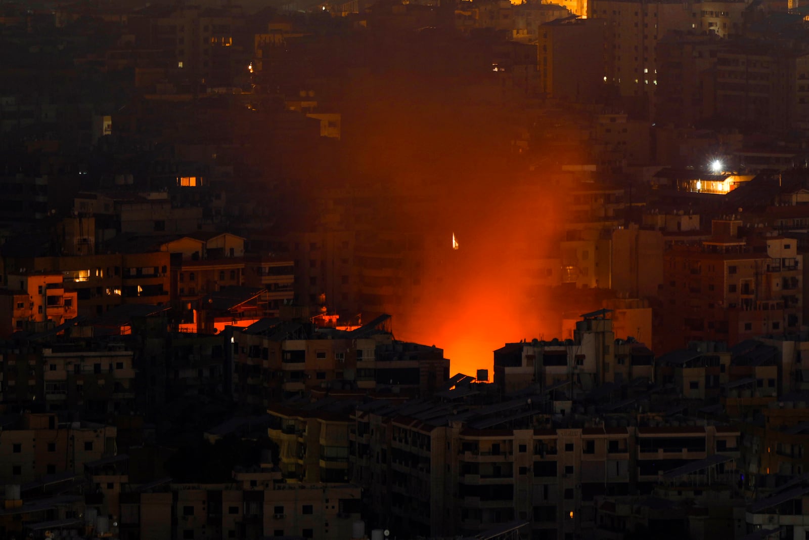 Smoke and fire rise from the site of an Israeli airstrike in Dahiyeh, Beirut, Lebanon, Friday, Oct. 25, 2024. (AP Photo/Hassan Ammar)