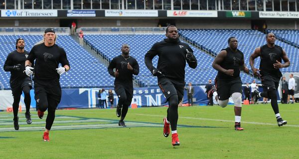 102515 NASHVILLE: -- Falcons players loosen up at Nissan Stadium as they prepare to play the Titans in a football game on Sunday, Oct. 25, 2015, in Nashville. Curtis Compton / ccompton@ajc.com