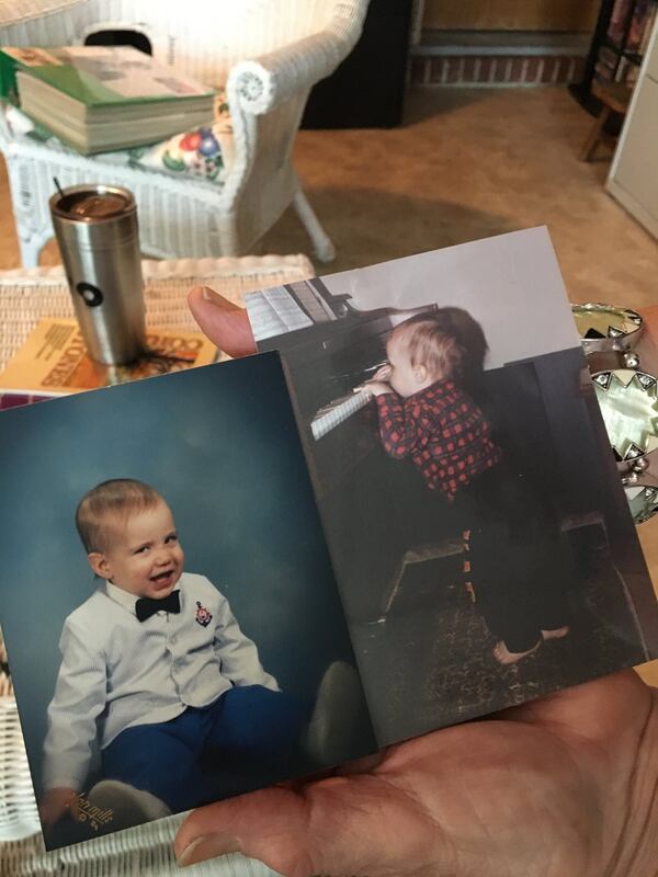 Nancy Jones holds up a photo of her son, Timothy, playing the piano at the age of two. Contributed by Frank Reddy