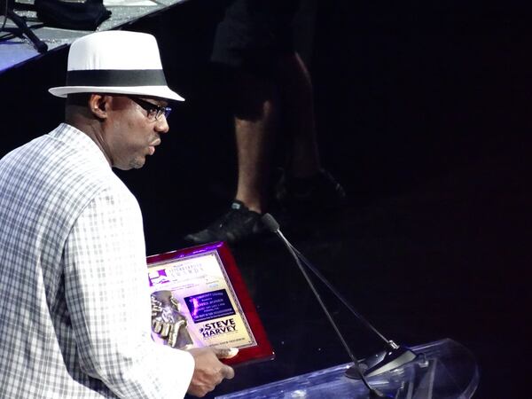 James Jones of Stockbridcge's Simply United Together accepts the Community Leader award and $30,000. CREDIT: Rodney Ho/ rho@ajc.com