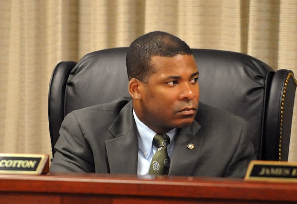 Board member Braxton Cotton during the state Board of Pardons and Paroles' monthly meeting, Tuesday, Aug. 5, 2014. KENT D. JOHNSON / KDJOHNSON@AJC.COM