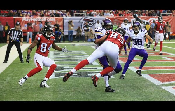 Vikings cornerback Terence Newman intercepts a pass from Falcons quarterback Matt Ryan in the endzone intended for wide receiver Roddy White (left) as tight end Jacob Tamme arrives late for the tackle during the third quarter in a football game on Sunday, Nov. 29, 2015, in Atlanta. Curtis Compton