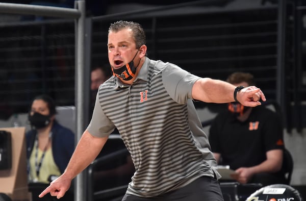 Mercer's head coach Greg Gary shouts instructions in the first half. (Hyosub Shin / Hyosub.Shin@ajc.com)