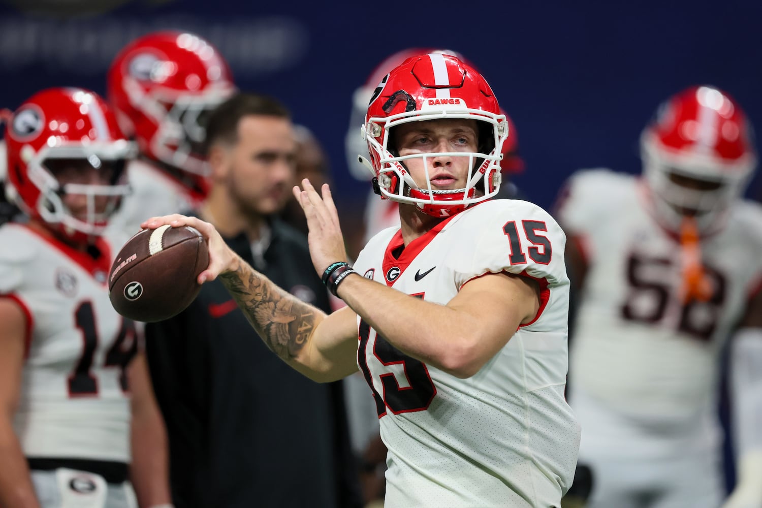 Georgia Bulldogs quarterback Carson Beck (15) warms up before facing the Alabama Crimson Tide during the SEC Championship football game at the Mercedes-Benz Stadium in Atlanta, on Saturday, December 2, 2023. (Jason Getz / Jason.Getz@ajc.com)