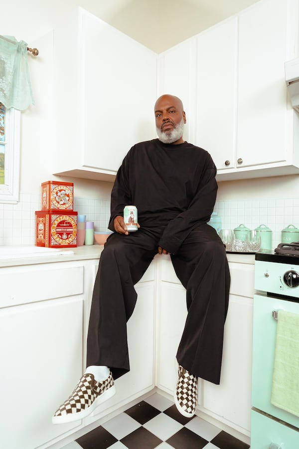 Kevin "Coach K" Lee poses with a can of Yacht Water.