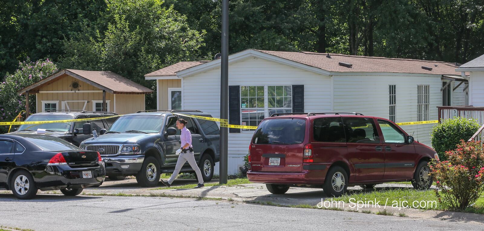 Authorities are investigating the death of four children ad their father at this Gwinnett County home. JOHN SPINK/ AJC