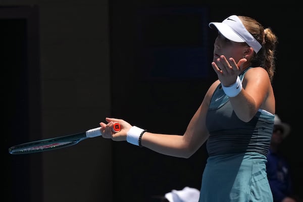 Mirra Andreeva of Russia reacts during her fourth round match against Aryna Sabalenka of Belarus at the Australian Open tennis championship in Melbourne, Australia, Sunday, Jan. 19, 2025. (AP Photo/Mark Baker)