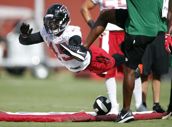 Atlanta Falcons outside linebacker Deion Jones (45) works on his kick blocking skills during an NFL football practice Friday, July 29, 2016, in Flowery Branch, Ga. (AP Photo/John Bazemore)