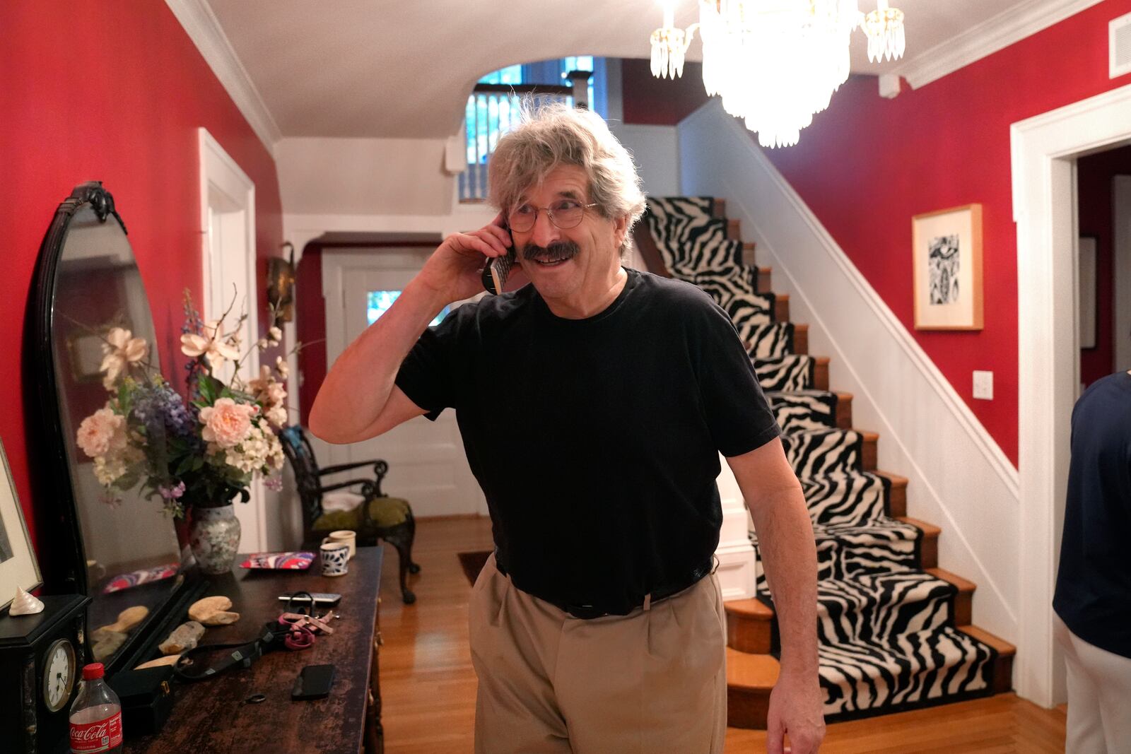 Gary Ruvkun, American molecular biologist, 2024 Nobel Prize winner in physiology or medicine, speaks on a phone, Monday, Oct. 7, 2024, at his home, in Newton, Mass. (AP Photo/Steven Senne)