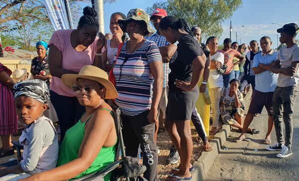 Namibians queue to cast their votes in a presidential election in Windhoek, Namibia Wednesday, Nov. 27, 2024. (AP Photo/Dirk Heinrich)