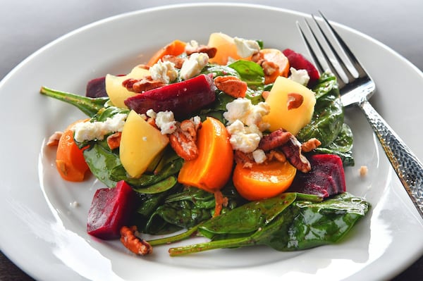 Roasted Beet Salad, roasted beets, praline pecans, poached apples, goat cheese, spinach, citrus beet vinaigrette. CONTRIBUTED BY CHRIS HUNT PHOTOGRAPHY