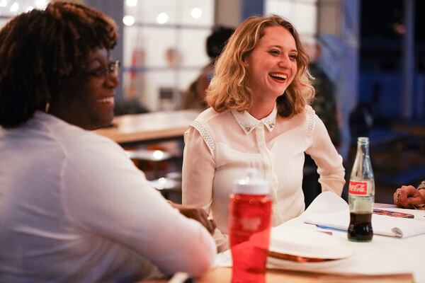 Glory Kilanko (left), director and CEO of Women Watch Afrika, speaks with Ashley Coleman of New American Pathways about the 2020 Census at Refuge Coffee. (Elijah Nouvelage for The Atlanta Journal-Constitution)