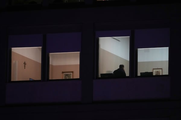 A man holds a mobile device in the ward where Pope Francis is hospitalized at the Agostino Gemelli Polyclinic, in Rome, Italy, Sunday, March 2, 2025. (AP Photo/Andrew Medichini)