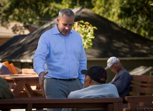 Tyler Bowser, an Air Force veteran, talks with residents at the Veterans Empowerment Organization facility in Atlanta. The VEO helps homeless veterans get off the street and back into a functioning civilian life. STEVE SCHAEFER / SPECIAL TO THE AJC