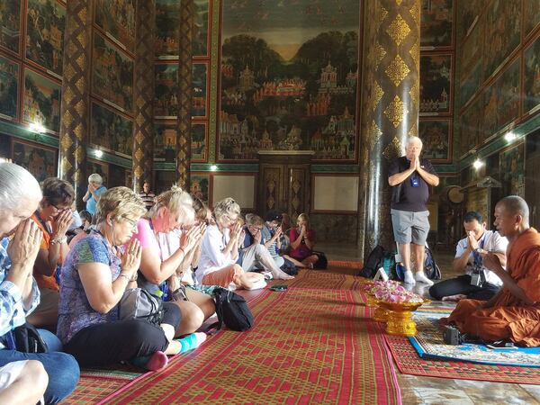 AmaWaterways cruise ship passengers receive a blessing at the Vipassana Dhura Buddhist Meditation Center in Oudong, Cambodia. CONTRIBUTED BY WESLEY K.H. TEO