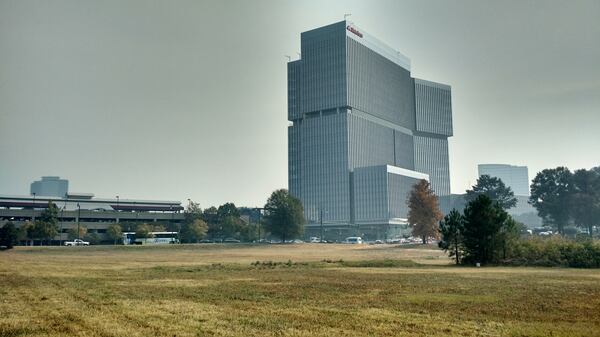 Smoke hangs over the new State Farm headquarters Thursday at Hammond Drive and Perimeter Center Parkway. BRIAN O’SHEA / BRIAN.OSHEA@AJC.COM