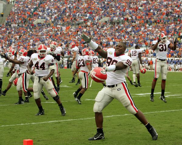 Georgia defensive tackle Jarius Wynn taunts Florida with a Gator chomp after the team's first score. (JASON GETZ / Staff)