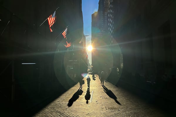 FILE - The morning sun shines on Wall Street in New York's Financial District on Tuesday, Nov. 19, 2024. (AP Photo/Peter Morgan)