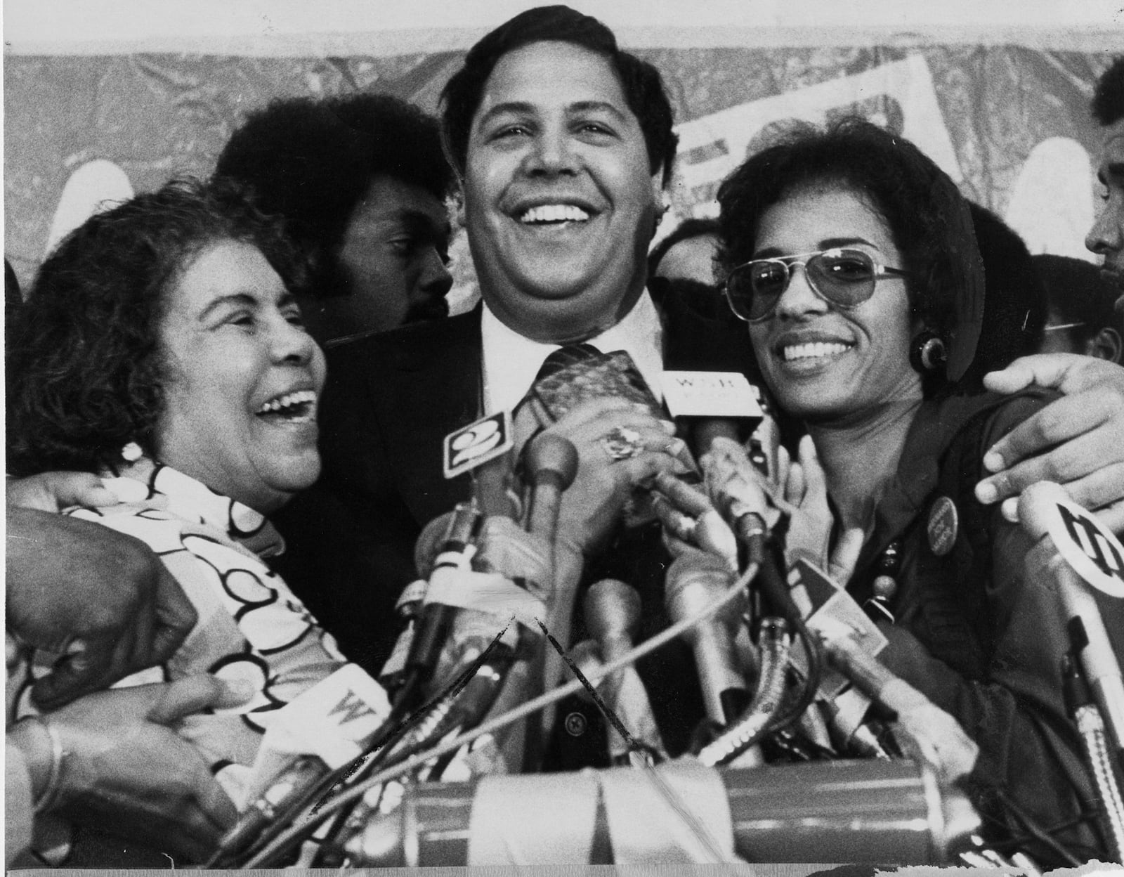 Oct, 1973 - Atlanta, Ga - Maynard Jackson hugs his mother, Dr. IRene Dobbs Jackson, and his wife, Bunnie.