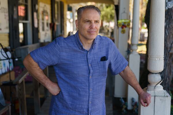 Brent Lackley poses for a portrait outside the store his mother works at, on Tuesday, November 9, 2021, in Juliette. (Elijah Nouvelage for The Atlanta Journal-Constitution)