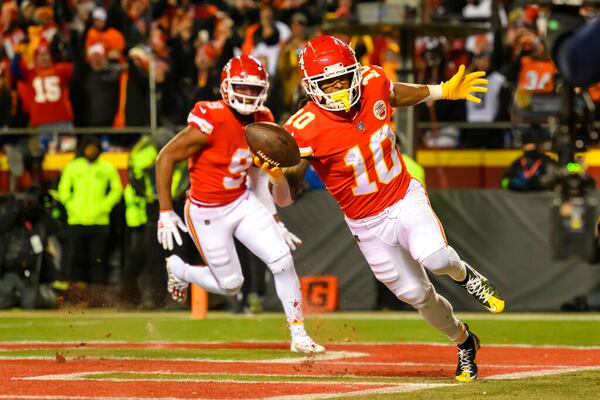 Kansas City Chiefs running back Isiah Pacheco (10) celebrates a touchdown with Chiefs wide receiver JuJu Smith-Schuster (9). (AP Photo/Reed Hoffmann)