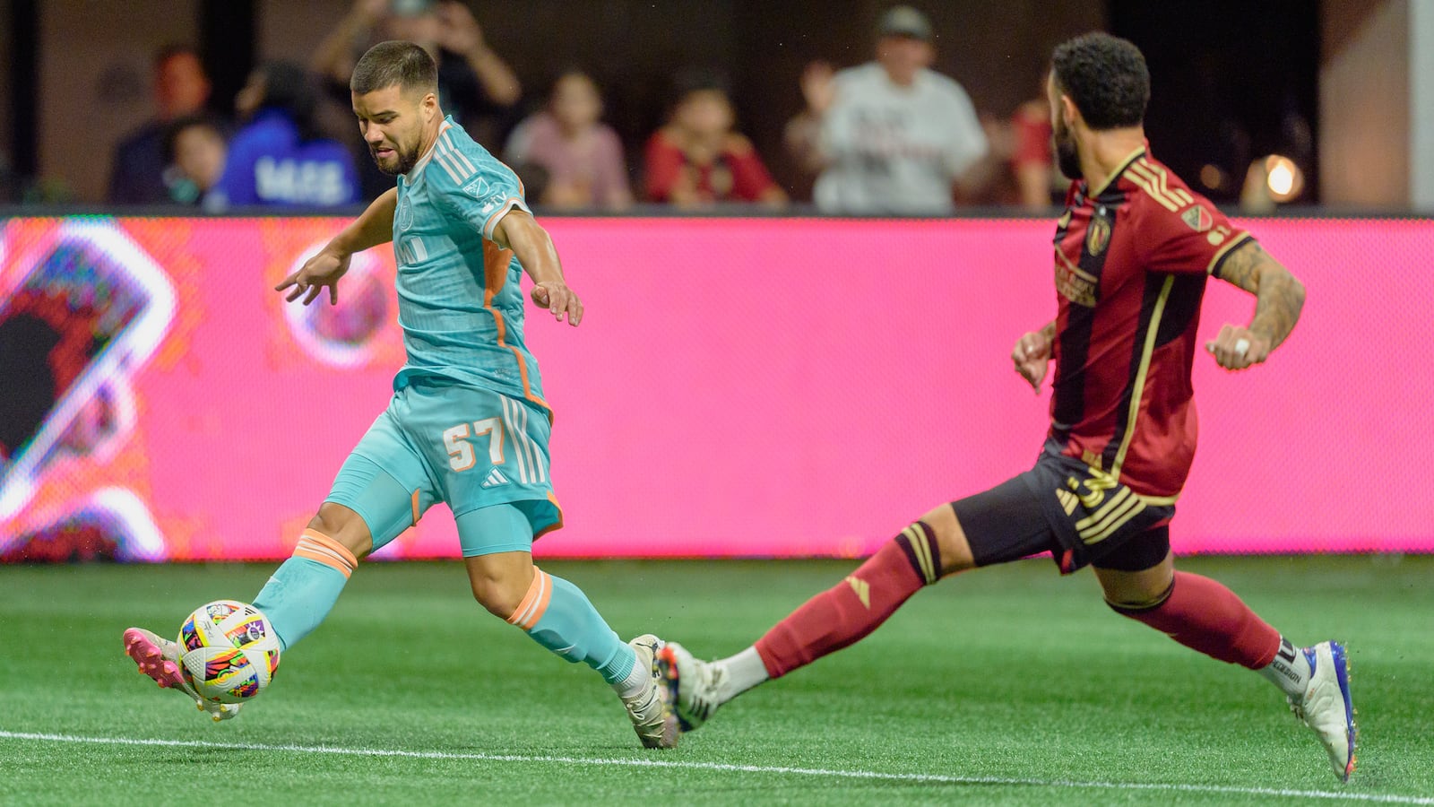 Inter Miami defender Marcelo Weigandt (57) centers the ball during the first half of an MLS soccer match against Atlanta United, Saturday, Nov. 2, 2024, in Atlanta. (AP Photo/Jason Allen)