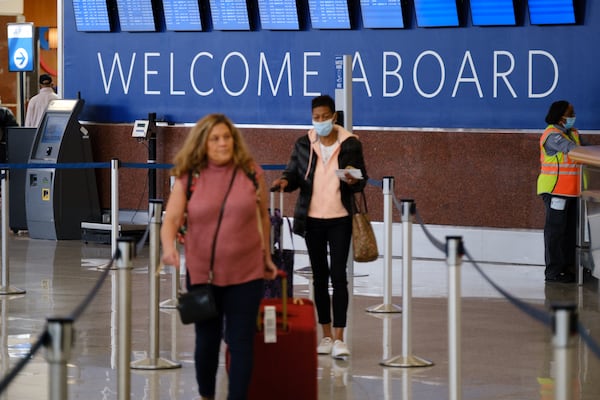 People are seen at Hartsfield-Jackson International Airport domestic terminal in Atlanta on Tuesday, April 19, 2022.  (Arvin Temkar / arvin.temkar@ajc.com)