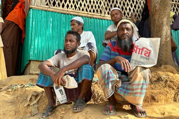 Rohingya refugees wait for food to be distributed during the Islamic holy month of Ramadan at their camp in Cox's Bazar, Bangladesh, Thursday, March 6, 2025. (AP Photo/Shafiqur Rahman)