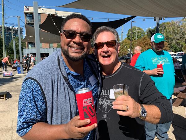 The 92.9/The Game afternoon show Carl Dukes and Mike Bell at New Realm Brewery October 22, 2022 to celebrate the station's 10th anniversary. RODNEY HO/rho@ajc.com