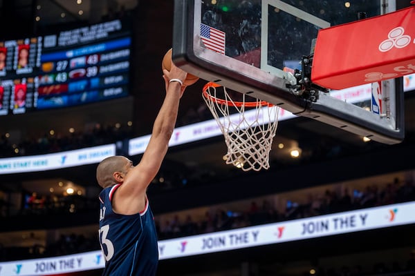 Los Angeles Clippers forward Nicolas Batum makes a slam dunk during the first half of an NBA basketball game against the Atlanta Hawks, Friday, March 14, 2025, in Atlanta. (AP Photo/Erik Rank)