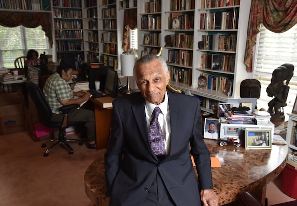 Portrait of C.T. Vivian at his home library as his daughter Charisse Thornton (background) and Dawnn Mitchell work on checking inventory on Tuesday, July 25, 2017. The National Monuments Foundation will be acquiring and managing the world-class library of Atlanta Civil Rights icon, C.T. Vivian. The library will be housed in the new Cook Park in Vine City. Vivian lived in the same Vine City neighborhood that will border Cook Park where his library is to be constructed under a 101-foot Peace Column. The 6,000 volume C.T. Vivian Library is one of the most impressive private collections in the city. HYOSUB SHIN / HSHIN@AJC.COM